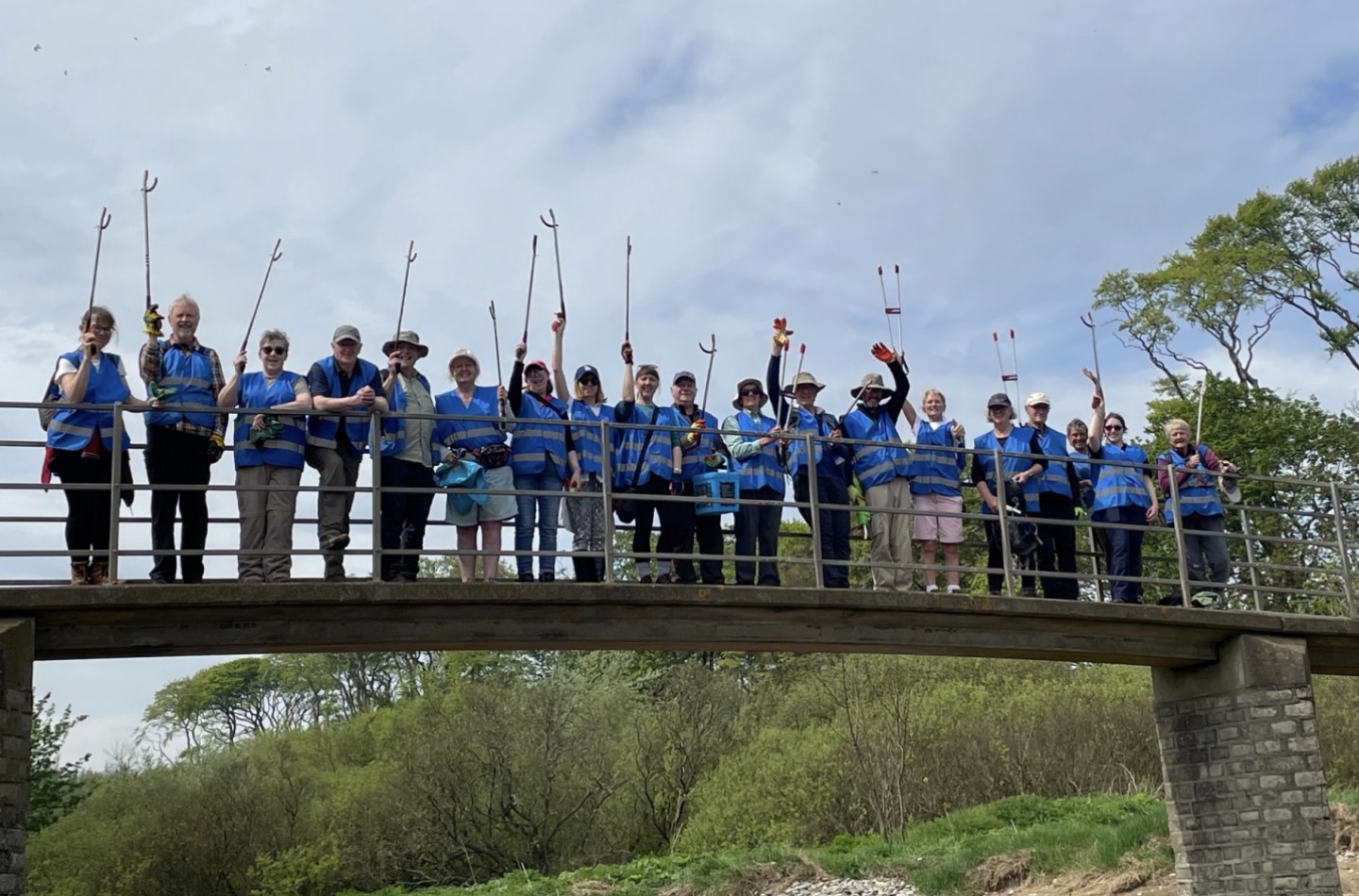 Conservation Team volunteers on a bridge