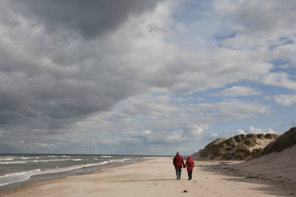 People walking along the coast